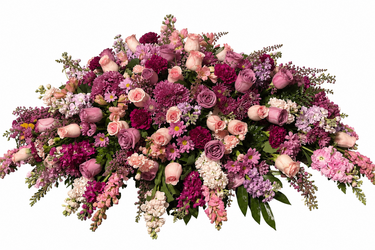 Rosewood Remembrance pink, mauve, and plum casket spray with roses, chrysanthemums, carnations, hydrangeas, and greenery